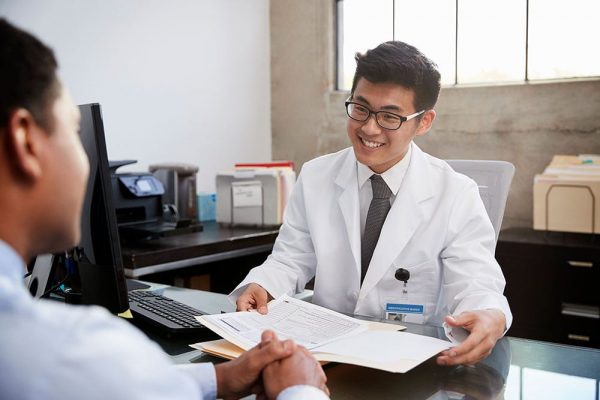 happy-asian-male-doctor-in-consultation-with-male